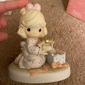 Precious moments “celebrating his arrival”